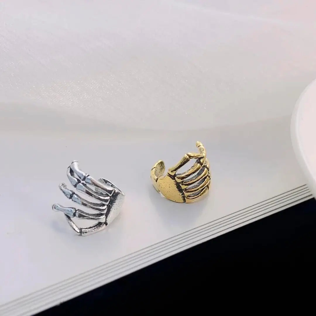 Brinco de Clipe Mão Esqueleto Prata Ouro Dourado  - NATA